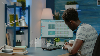 Man working with stock market trading value on computer stock photo NULLED