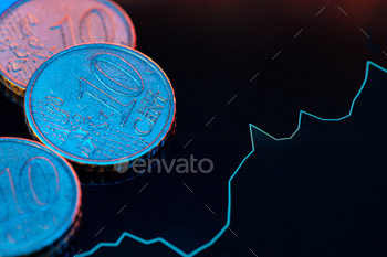 Euro coin on stock chart. Financial investment concept stock photo NULLED