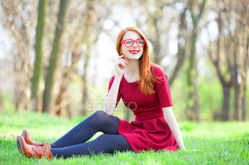 Redhead women  in a park stock photo NULLED