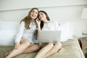 Women in the bed with laptop