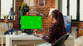 African american freelancer watching computer with greenscreen stock photo NULLED