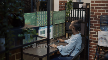 African american woman analyzing stock market investment stock photo NULLED