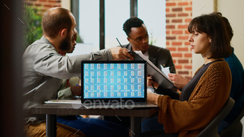 Business colleagues wokring with real time stock market stock photo NULLED