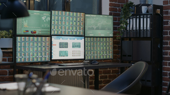 Empty multi monitors workstation with stock market statistics stock photo NULLED