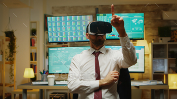 Male stock market trader using virtual reality stock photo NULLED