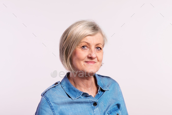Portrait of a senior woman in studio. stock photo NULLED