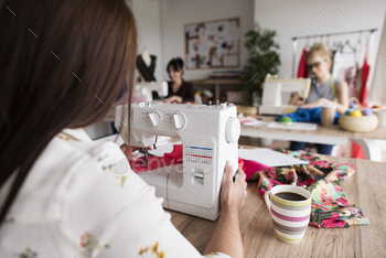 Sewing women at the workshop stock photo NULLED