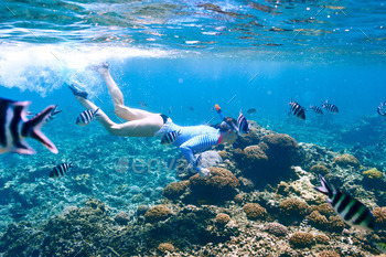 Woman with mask snorkeling stock photo NULLED