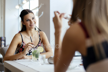 Women talking in restaurant
