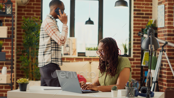 Young freelancer working remotely from home stock photo NULLED