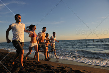 people group running on the beach stock photo NULLED